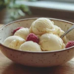 bowl of creamy fresh fruit ice cream with visible fruit chunks