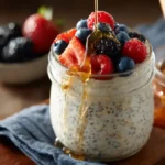 Creamy chia overnight oats topped with berries in a jar