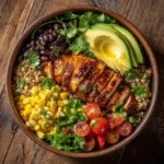 baja hot honey chicken bowl on rustic table