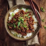 korean beef bowl with rice, green onions, and sesame